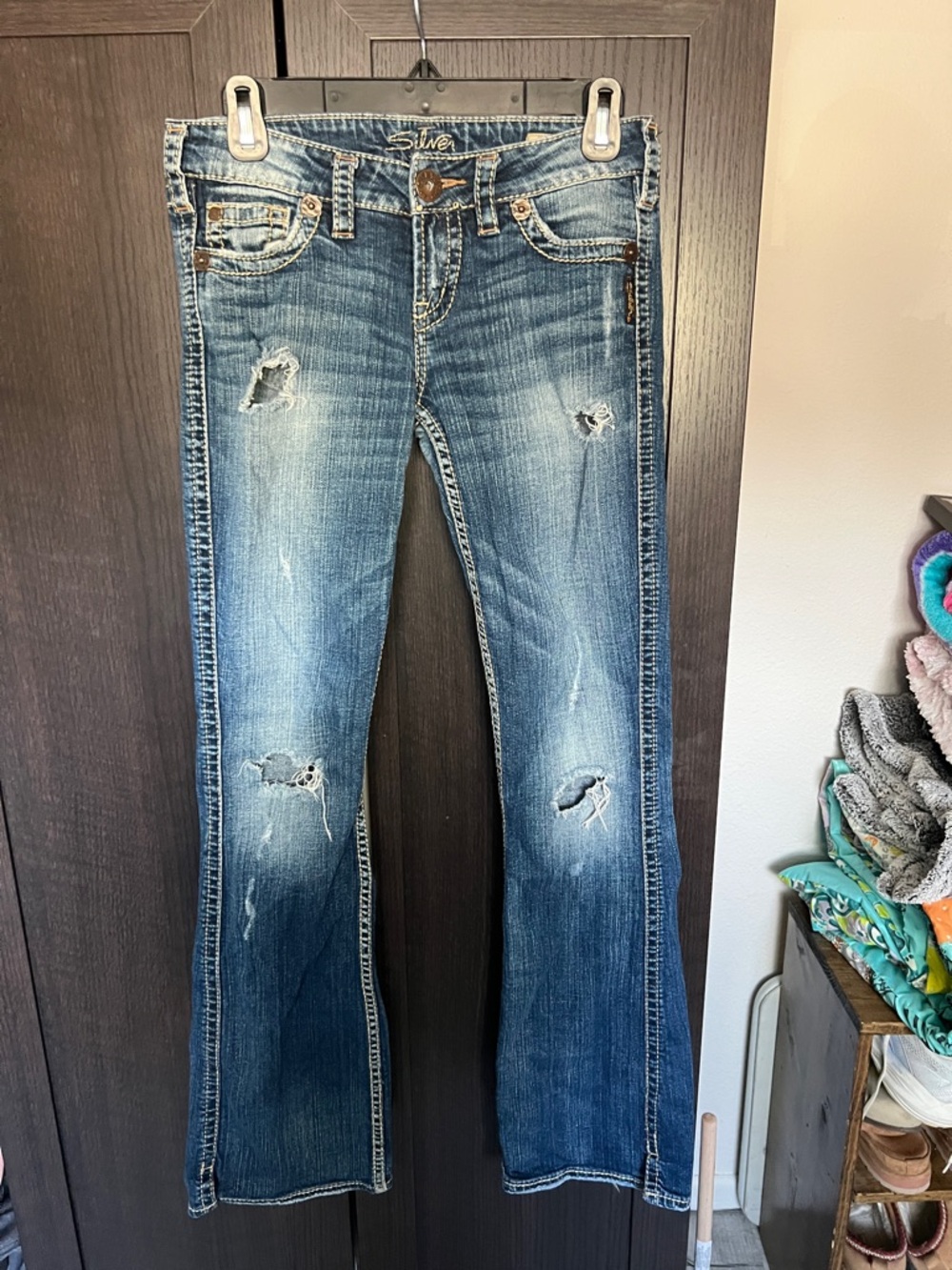 Silver Jeans Women's Distressed Flare Jeans in Blue Denim